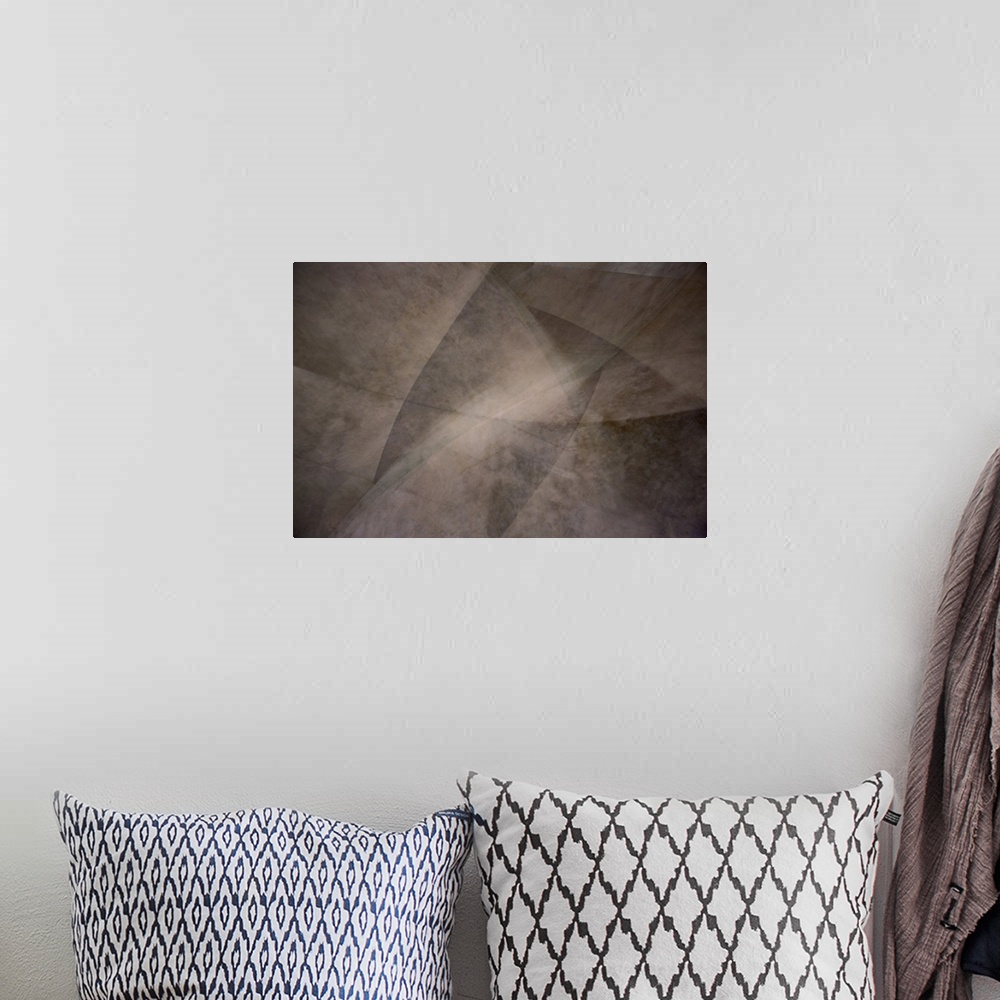 A bohemian room featuring Abstract art in shades of brown split with thin lines into angled sections.