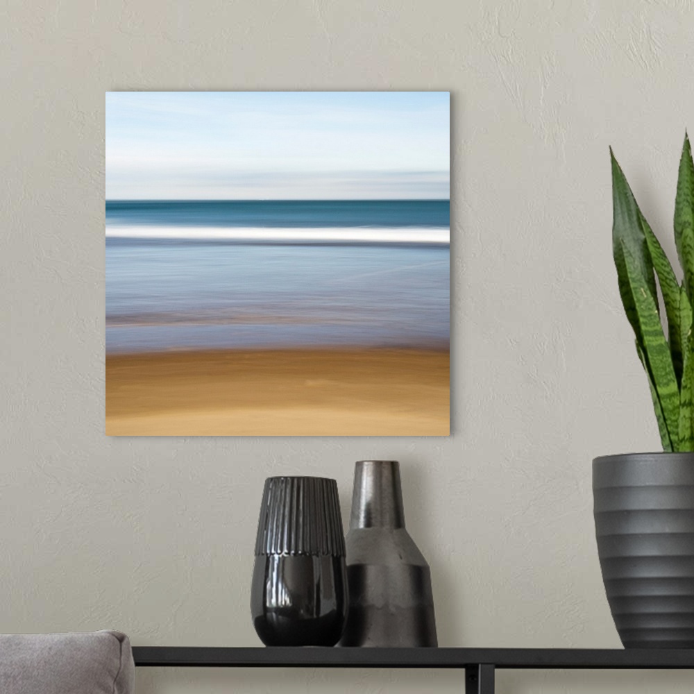 A modern room featuring A square canvas of a peaceful seascape with smooth color transitions.