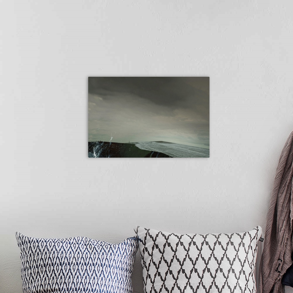 A bohemian room featuring Conceptual image of a restless ocean and the tide rolling in on an overcast day.