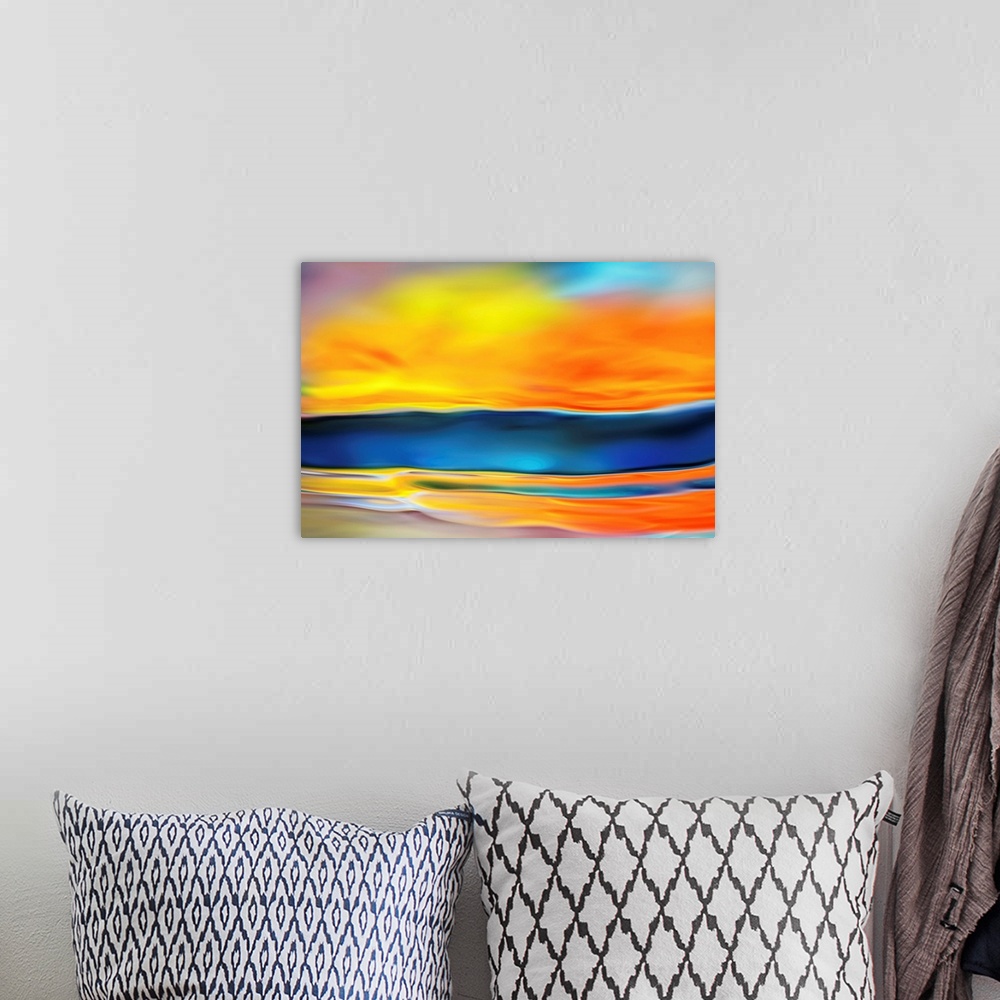 A bohemian room featuring Abstract photo of smooth waves in contrasting warm and cool tones.