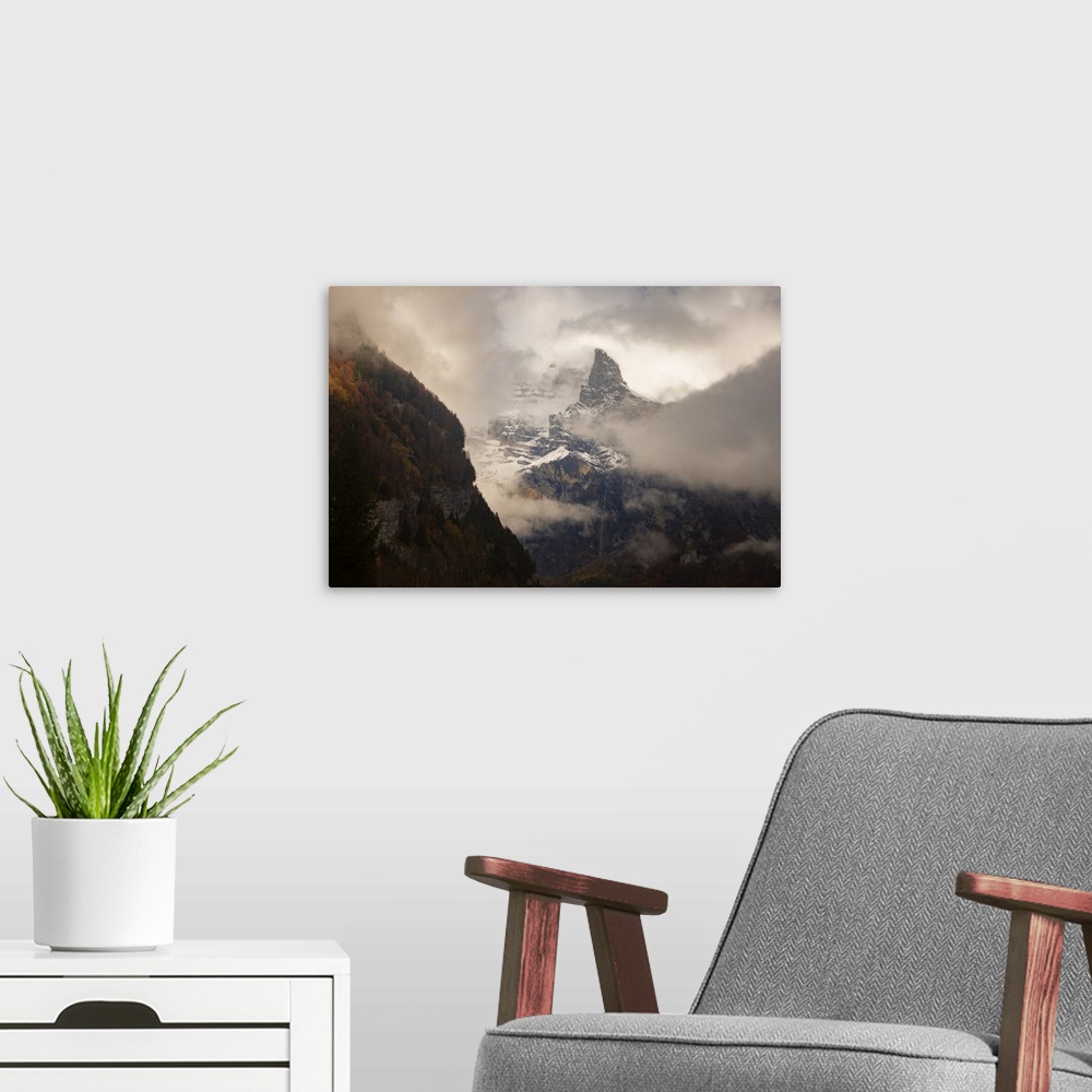 A modern room featuring Place of Sixt-Fer-a-Cheval area in Savoie, France, big rocky mountain with snow going throw the f...