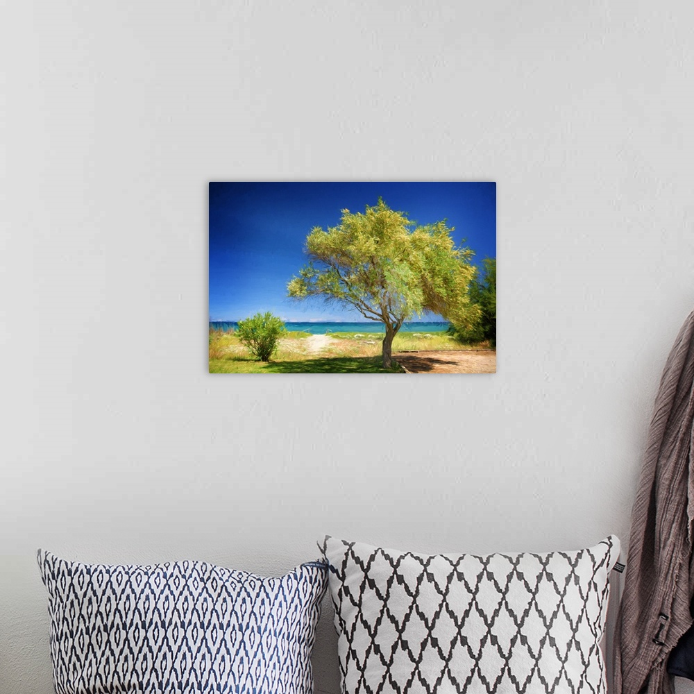 A bohemian room featuring Photo painting of a lush green tree blowing in the wind with a sandy path leading to the ocean in...
