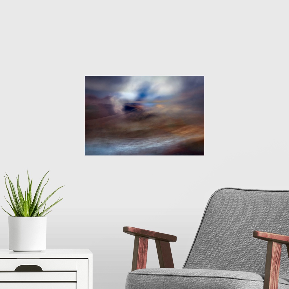 A modern room featuring An impressionistic dreamy blurred Turneresque seascape of swirling water and sky in blues, orange...