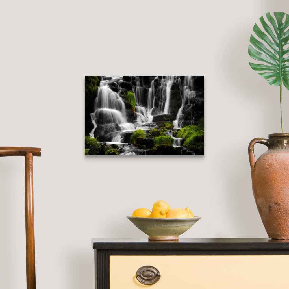 A traditional room featuring Fine art photo of a waterfall over several round rocks