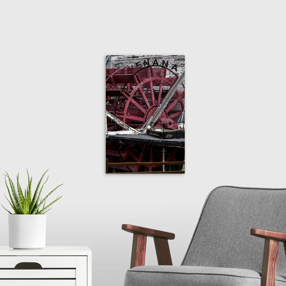 A modern room featuring Alaskan Steamboat Nanana paddle wheel at rest.