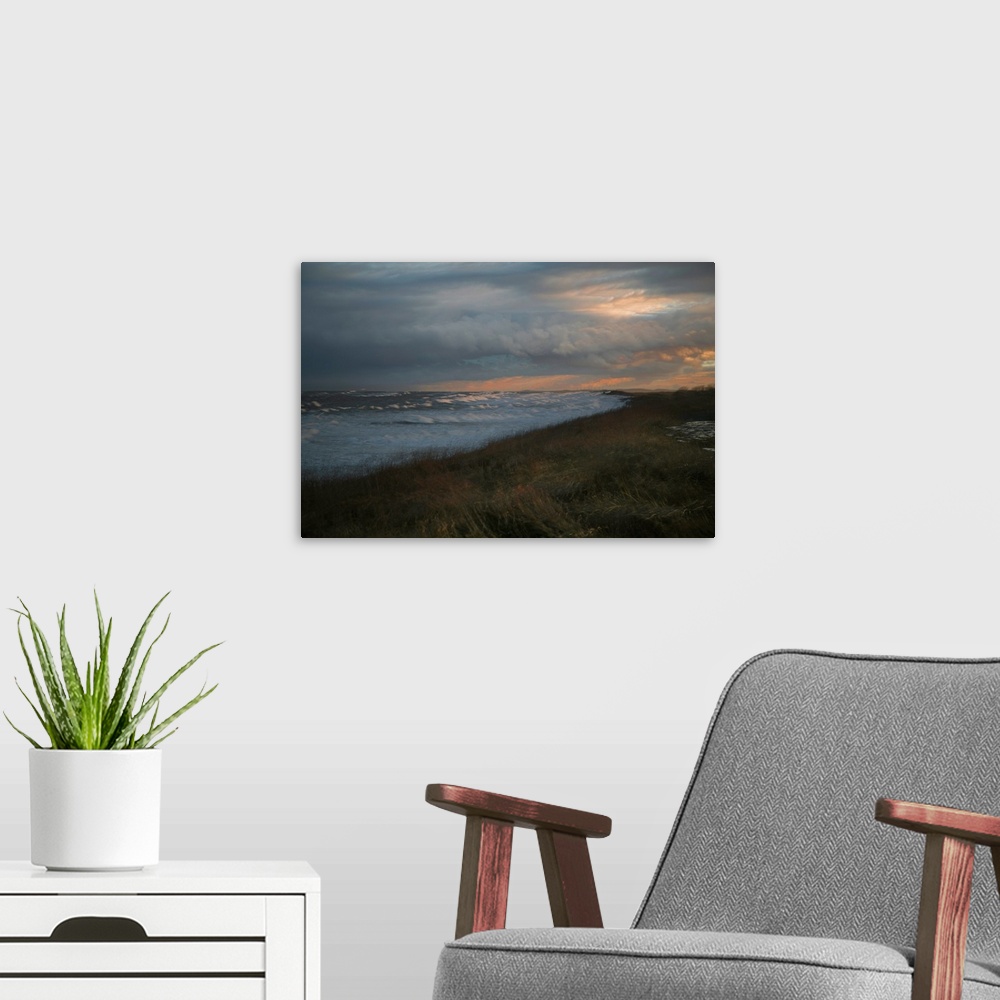 A modern room featuring Long exposure photograph of and ocean view with the warm setting sun.