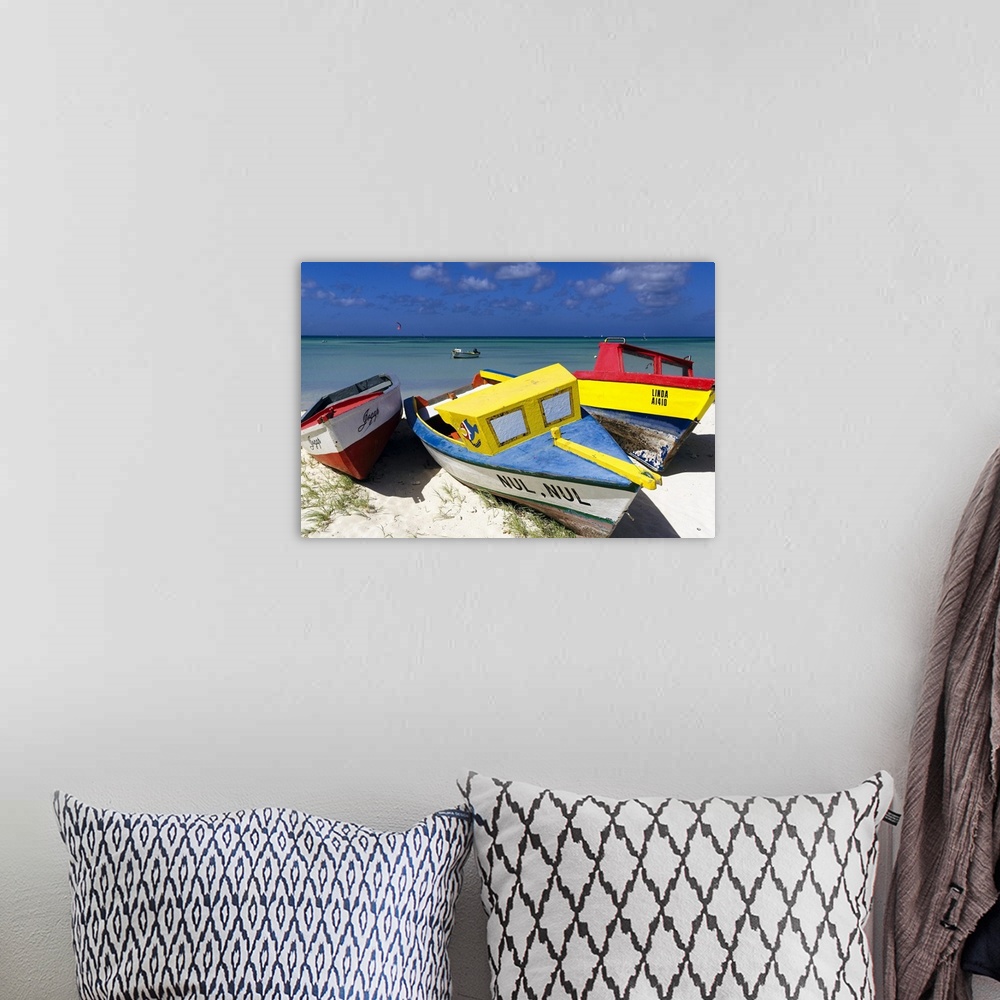 A bohemian room featuring A photograph of colorful boats sitting on the shore of a tropical beach.