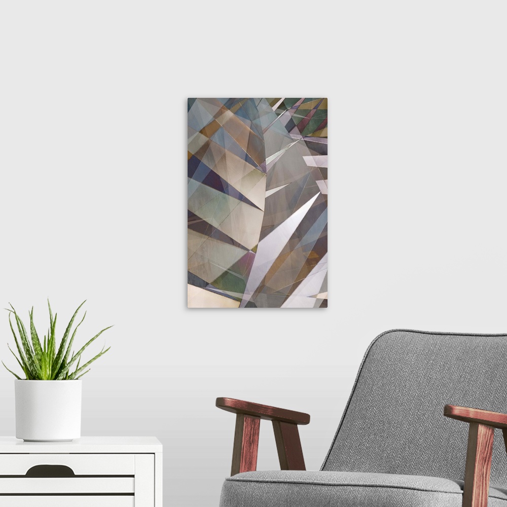 A modern room featuring Abstract photograph made of intersecting angles and lines in varying neutral shades.