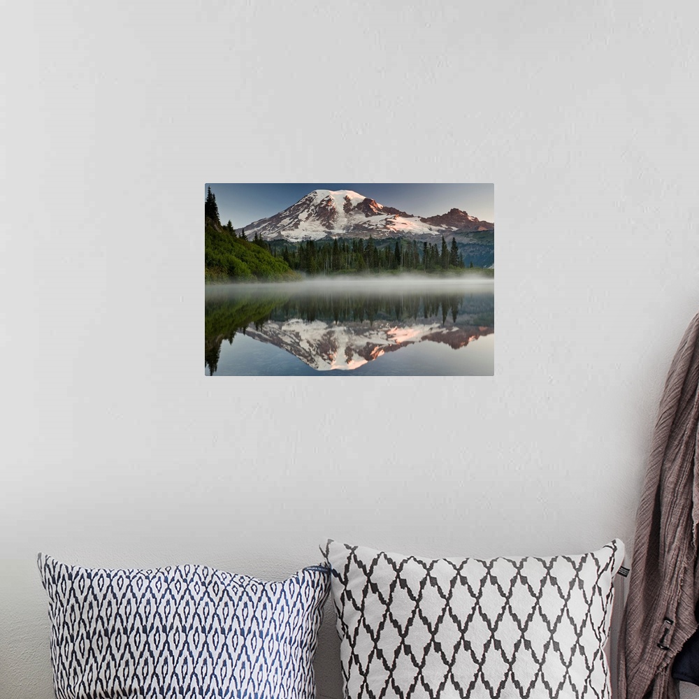 A bohemian room featuring Big photograph shows the great size of snow-covered Mount Rainier in the background reflecting ov...