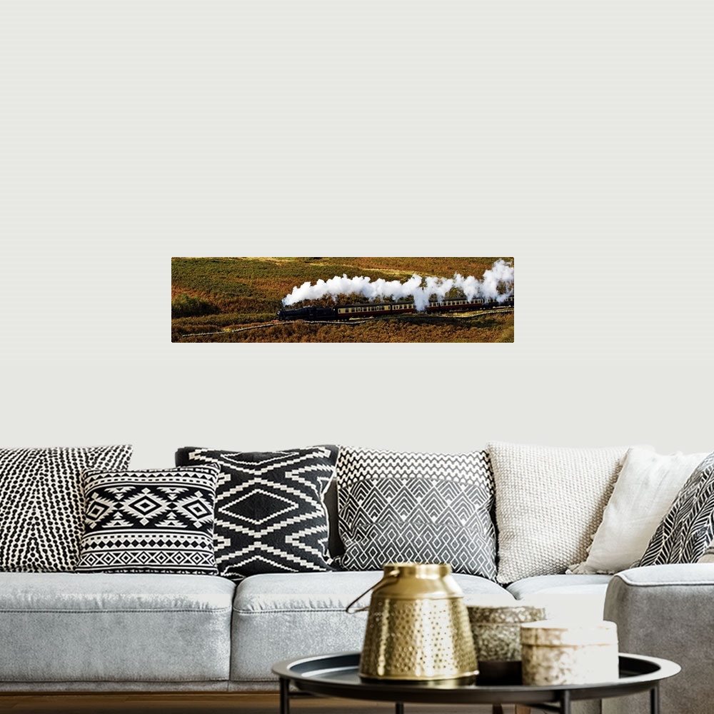 A bohemian room featuring A steam train panorama as the train flows through a moorland landscape in Yorkshire, UK, with ste...