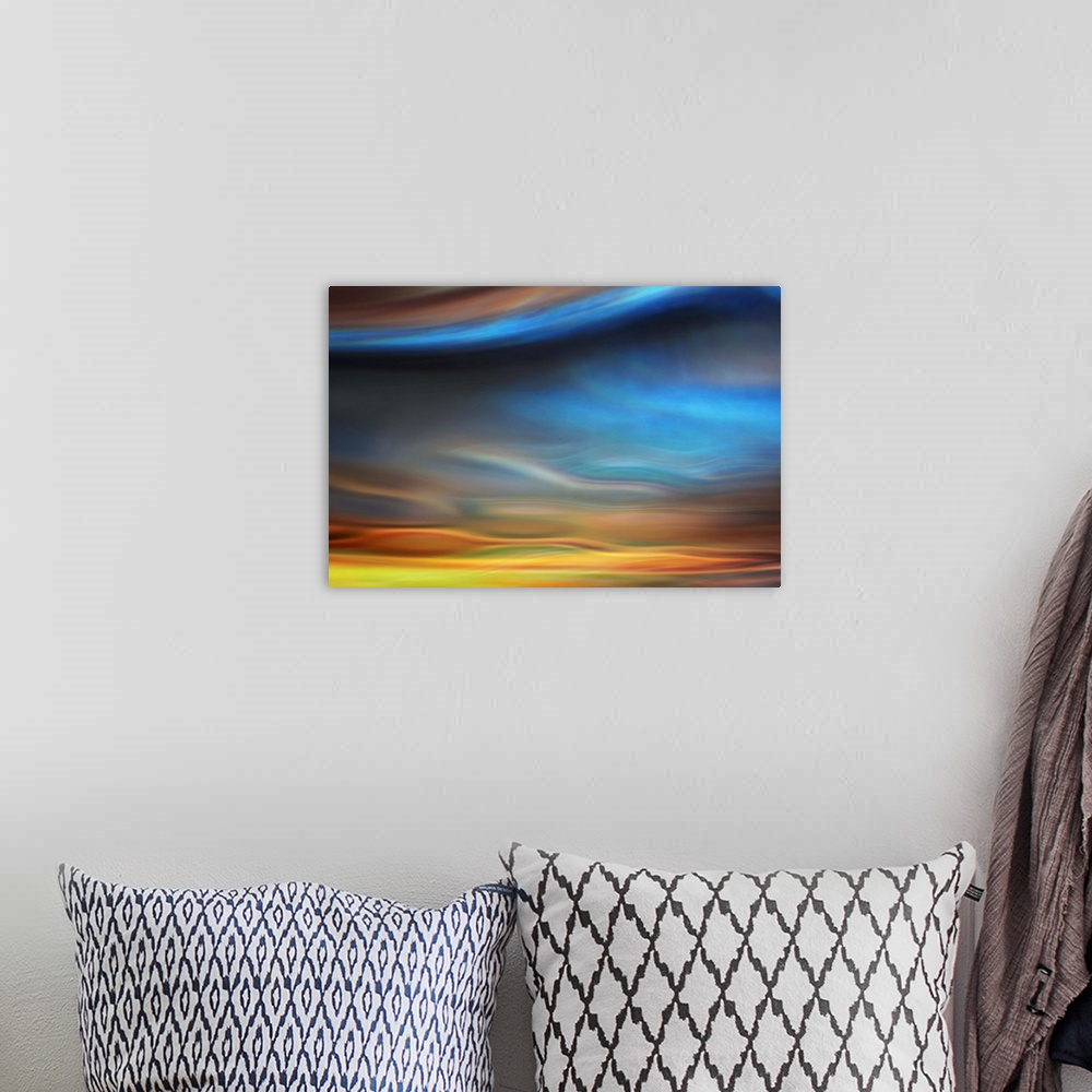 A bohemian room featuring Abstract photo of smooth waves resembling the sky at sunset.