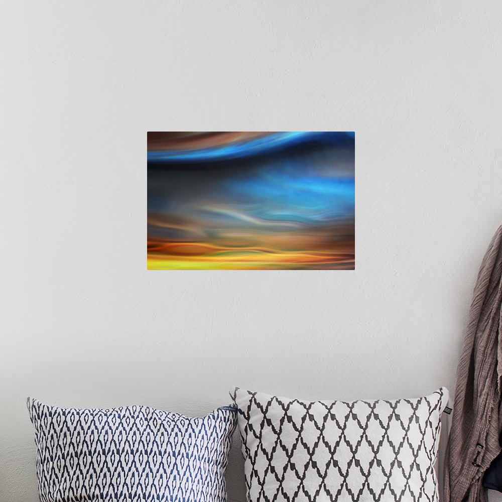 A bohemian room featuring Abstract photo of smooth waves resembling the sky at sunset.