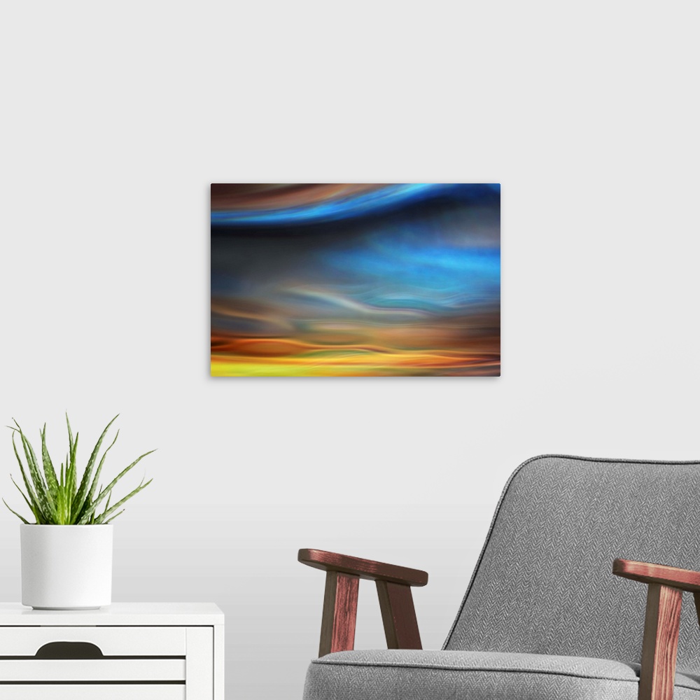 A modern room featuring Abstract photo of smooth waves resembling the sky at sunset.