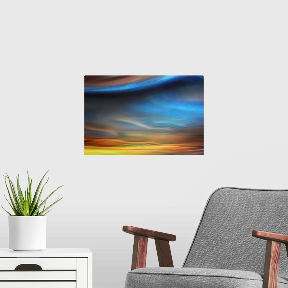 A modern room featuring Abstract photo of smooth waves resembling the sky at sunset.