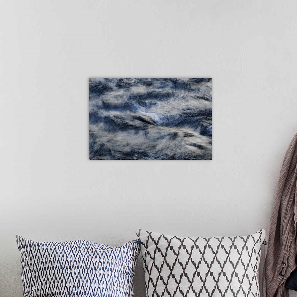 A bohemian room featuring A contemporary natural abstract of deep silvery blue rushing water swirling around the frame.