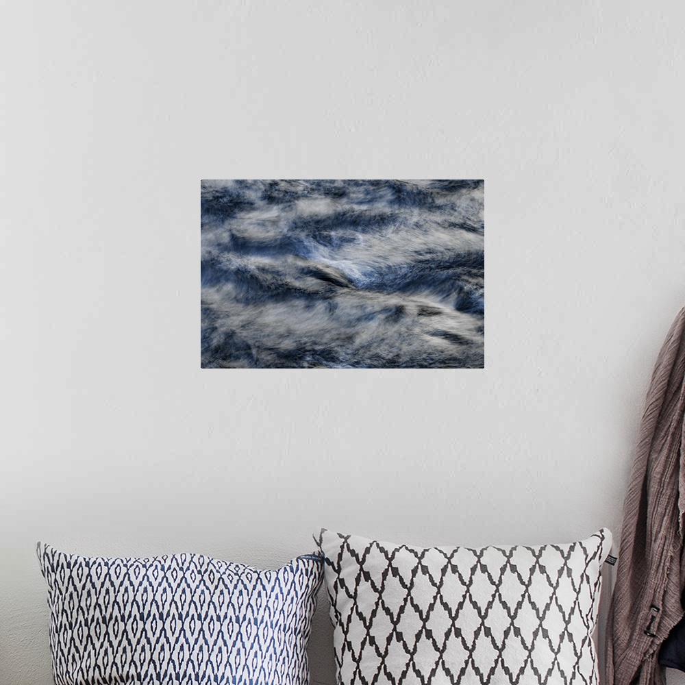 A bohemian room featuring A contemporary natural abstract of deep silvery blue rushing water swirling around the frame.