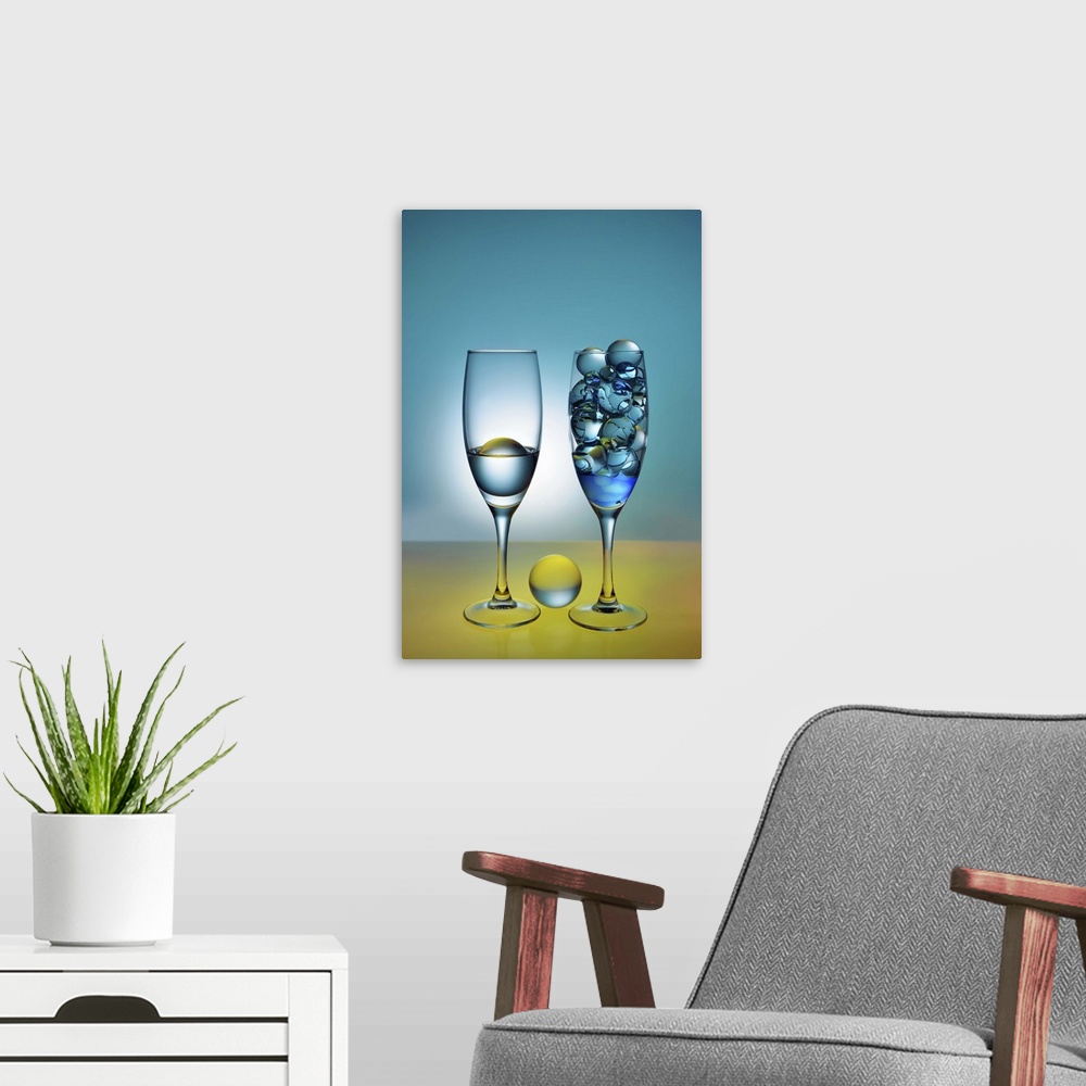 A modern room featuring A photograph of glass orbs sitting in tall wine glasses.