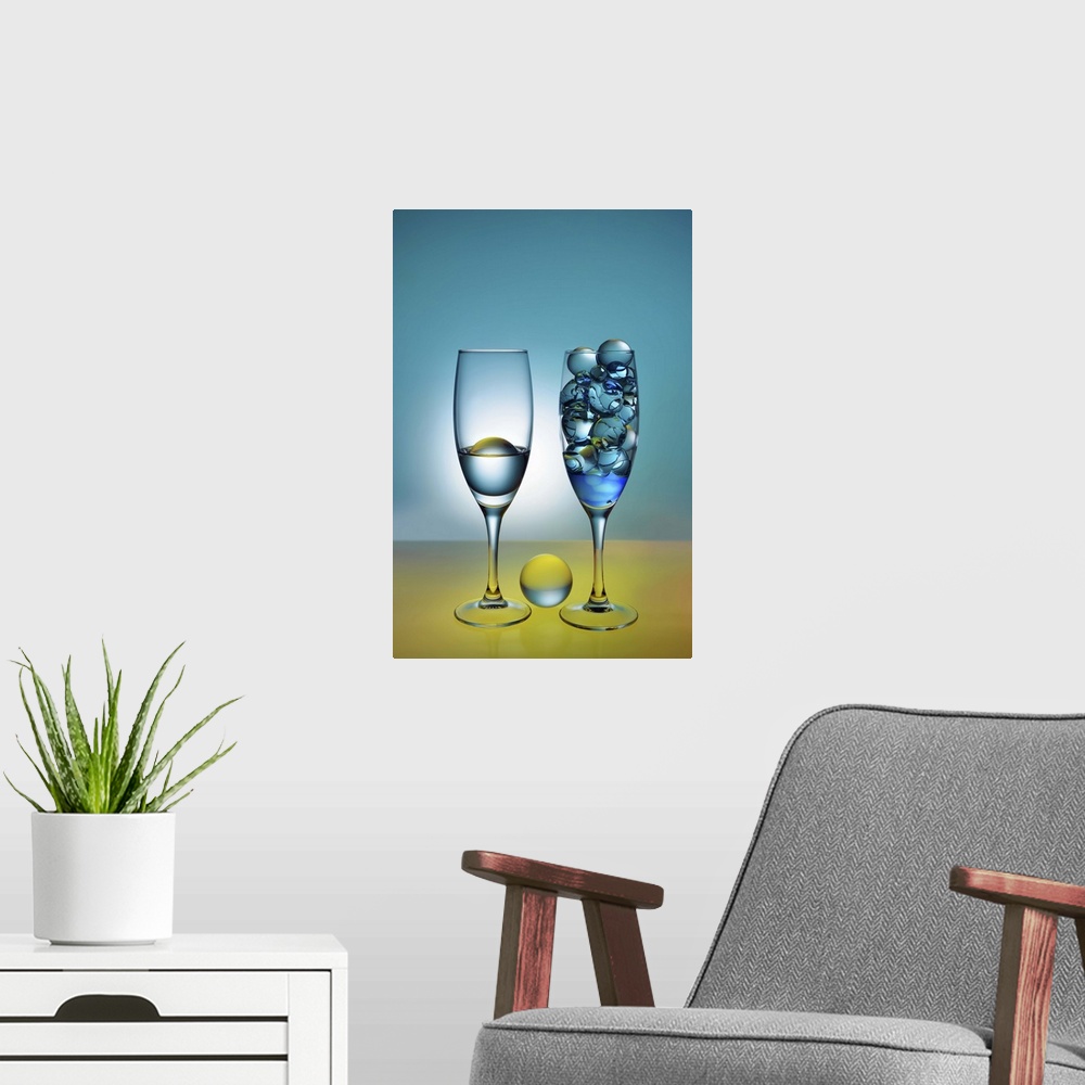 A modern room featuring A photograph of glass orbs sitting in tall wine glasses.