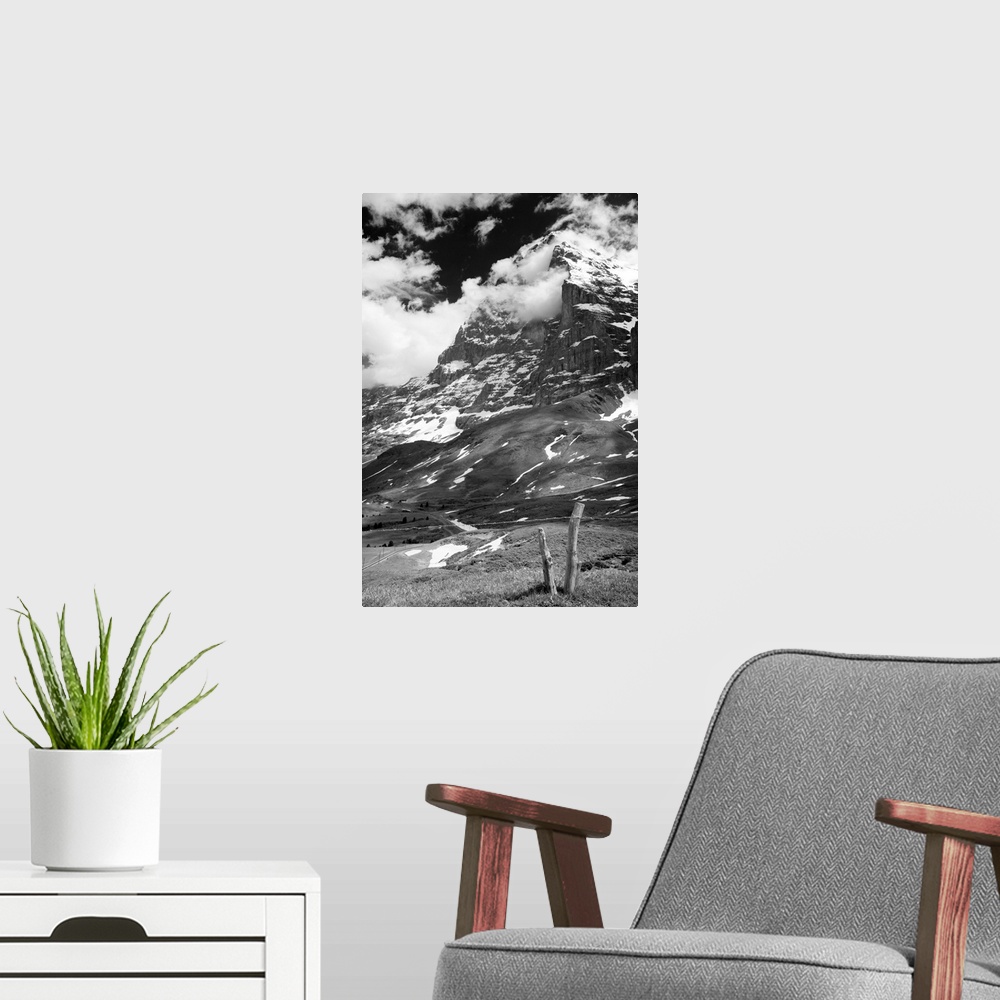 A modern room featuring Black and white photo of the Swiss Alps