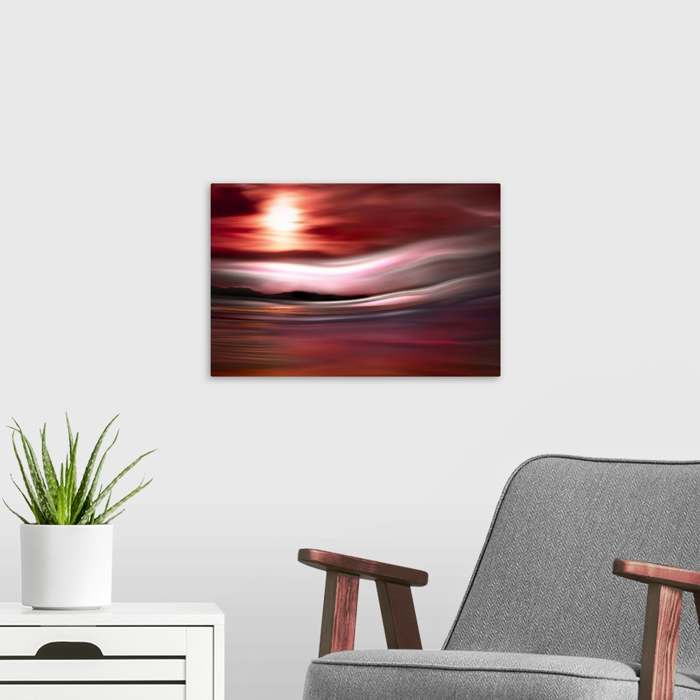 A modern room featuring Abstract photograph of a red, pink, and purple sunset in Vancouver with a mountain line silhouett...