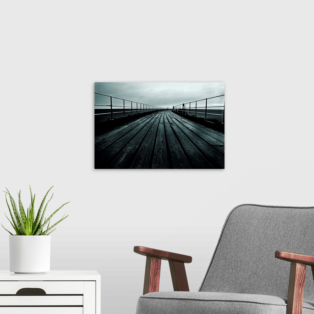 A modern room featuring Docor for the home or office of a photograph that has been taken staring down a pier that comes t...