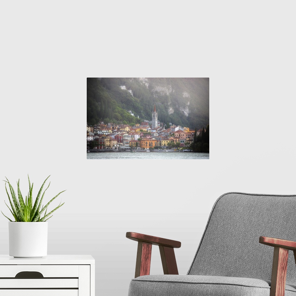 A modern room featuring The city of Varenna in Italy at the bottom of the Alps on the coast.