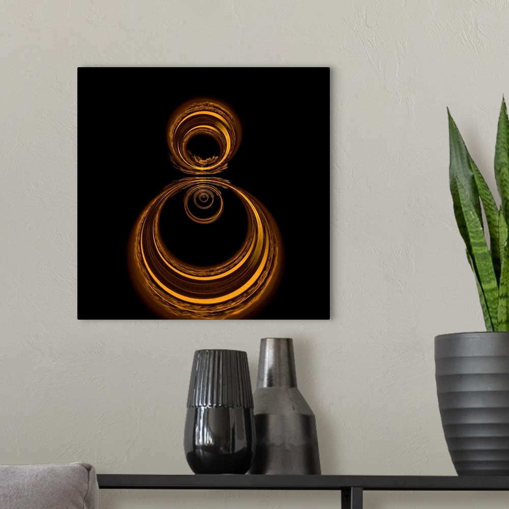A modern room featuring Square abstract art with gold circles formed together on a black background.