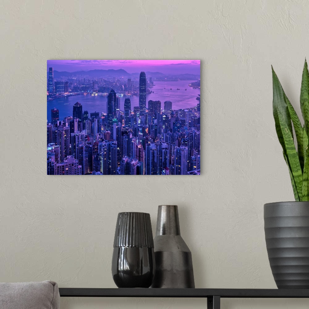 A modern room featuring Ariel view of the city of Hong Kong, China at sunset.