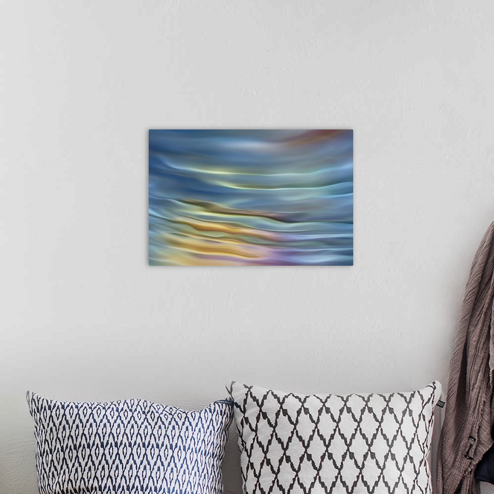 A bohemian room featuring Abstract photograph in pastel yellow and blue shades resembling ocean waves.