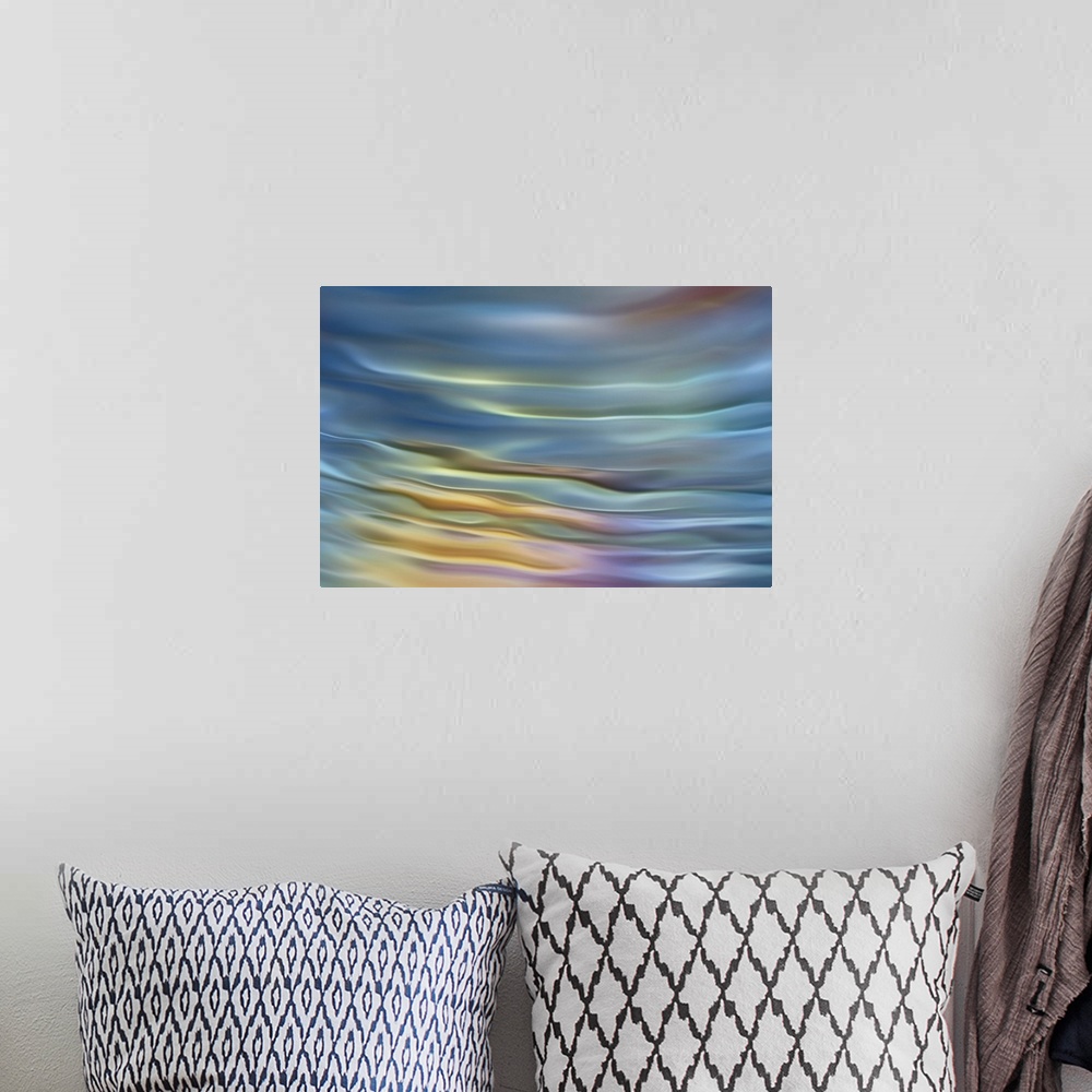A bohemian room featuring Abstract photograph in pastel yellow and blue shades resembling ocean waves.
