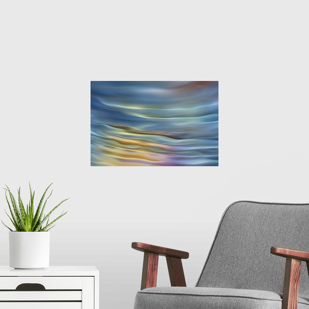A modern room featuring Abstract photograph in pastel yellow and blue shades resembling ocean waves.