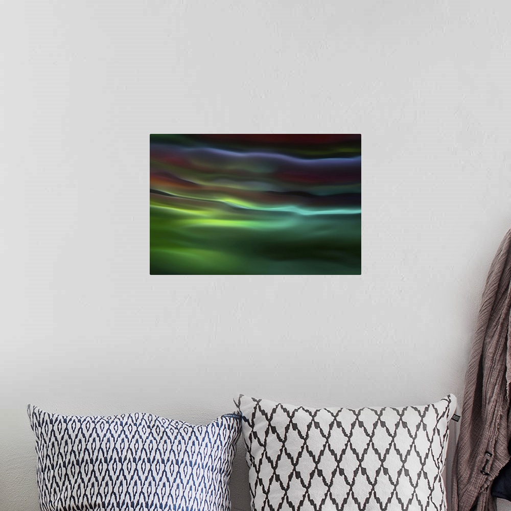 A bohemian room featuring Abstract photograph in green and blue shades resembling ocean waves.
