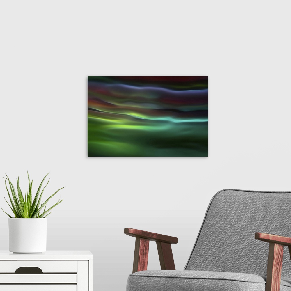 A modern room featuring Abstract photograph in green and blue shades resembling ocean waves.