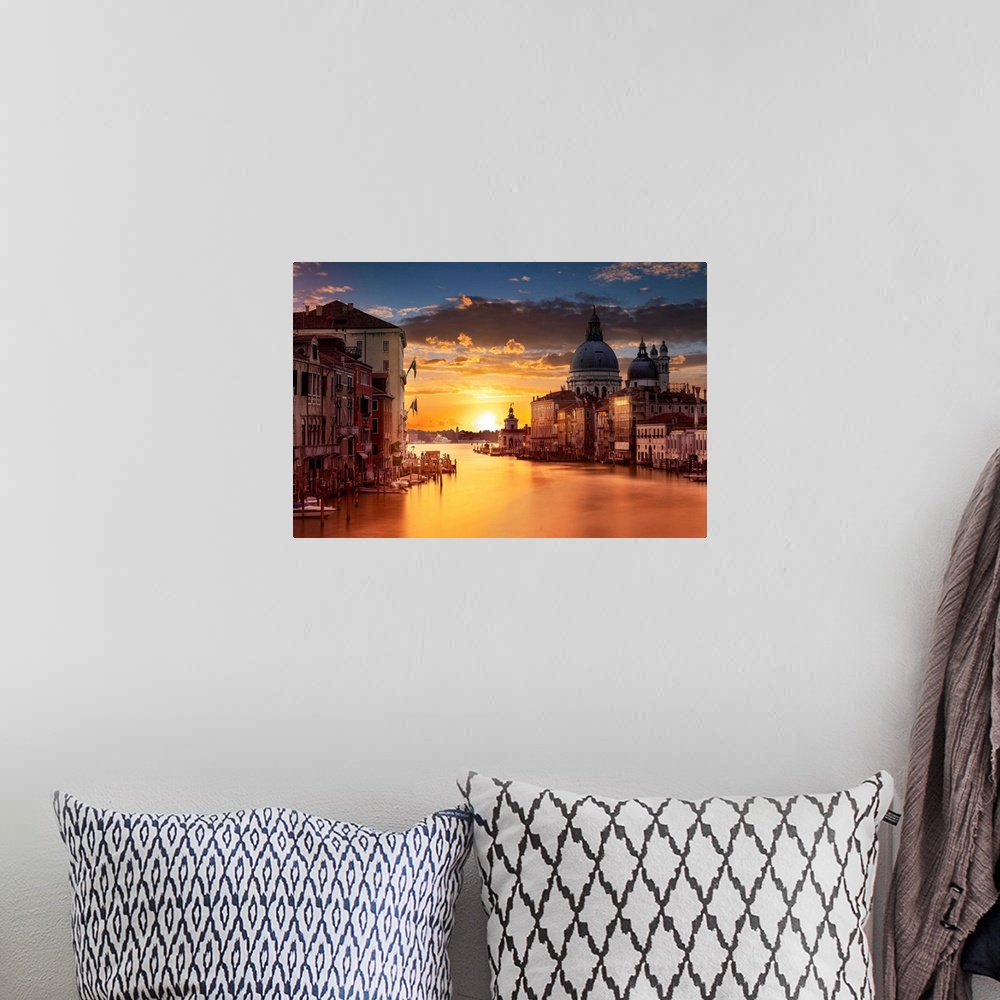 A bohemian room featuring Photograph of the city of Venice, Italy at sunset.