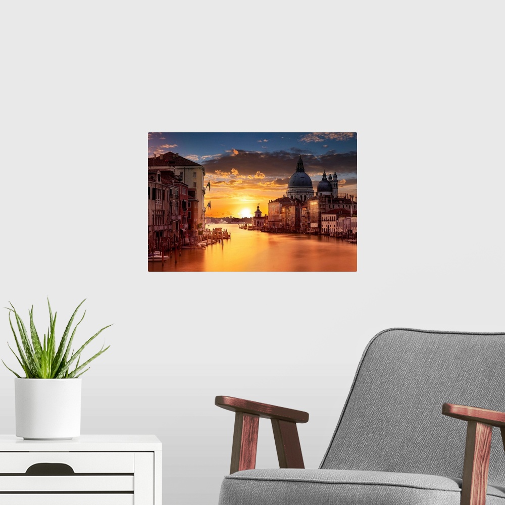 A modern room featuring Photograph of the city of Venice, Italy at sunset.