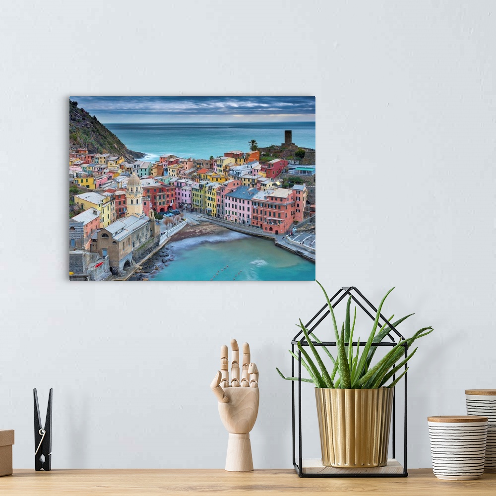 A bohemian room featuring Photograph of the harbor in the village of Vernazza in Cinque Terre, Italy.