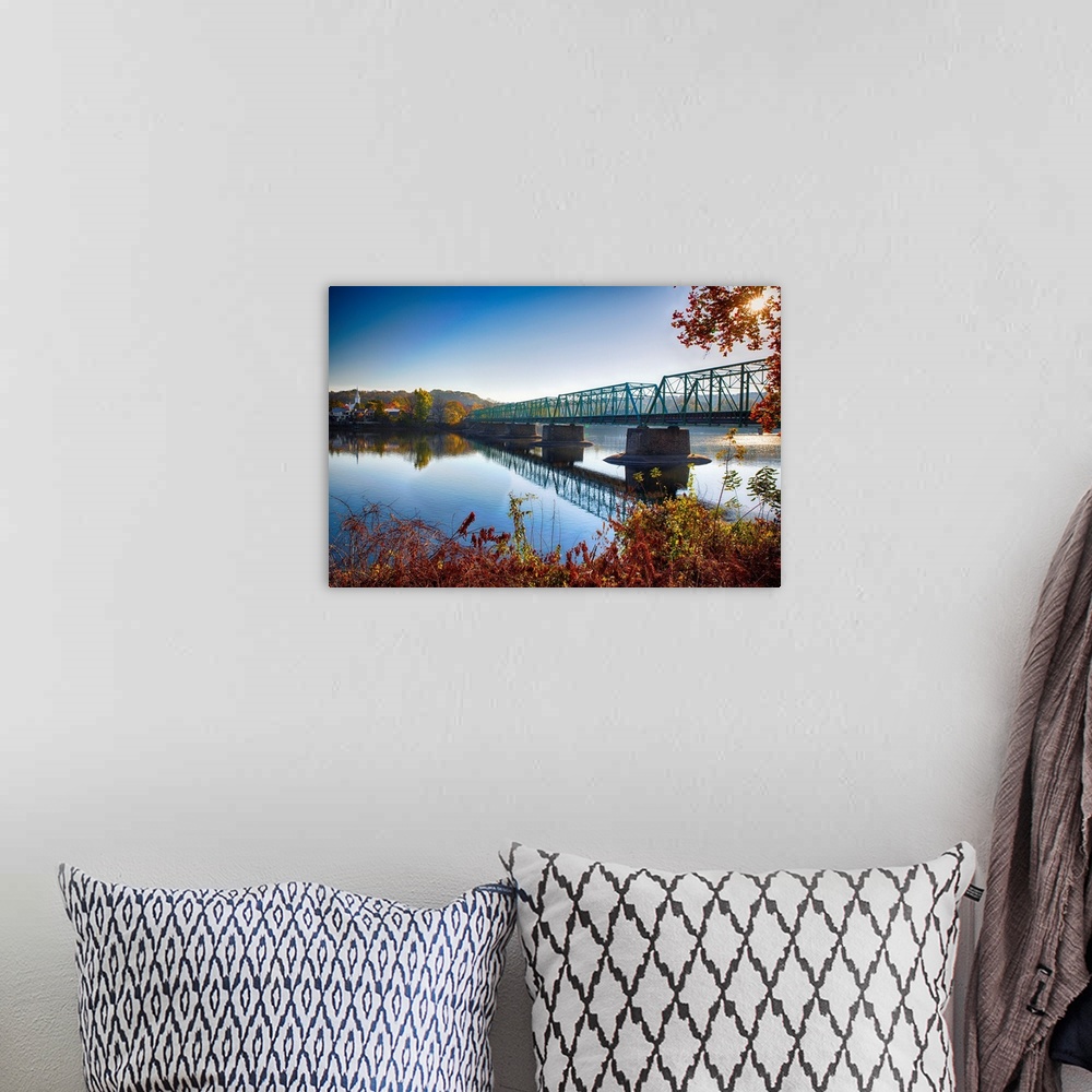 A bohemian room featuring Fine art photo of a bridge crossing a wide river in New Jersey.