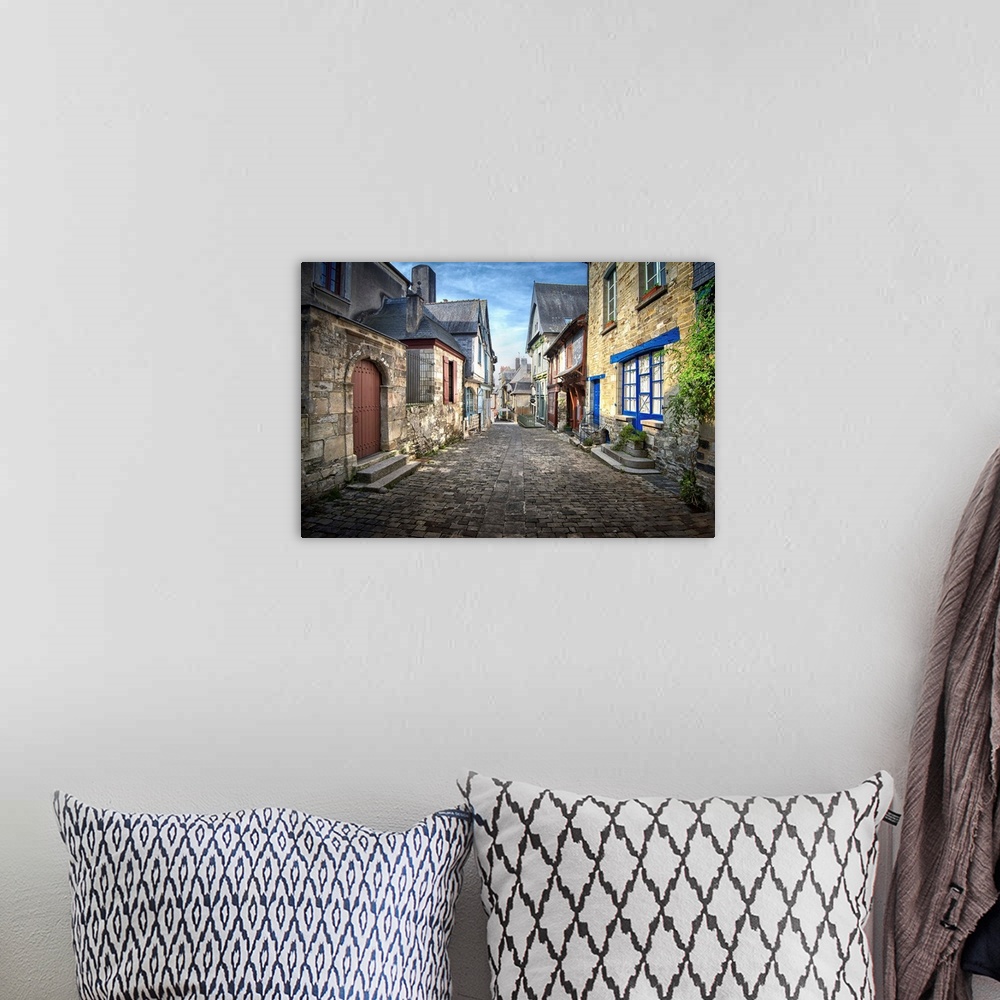 A bohemian room featuring Fine art photo of a street in a medieval town in the north of France.