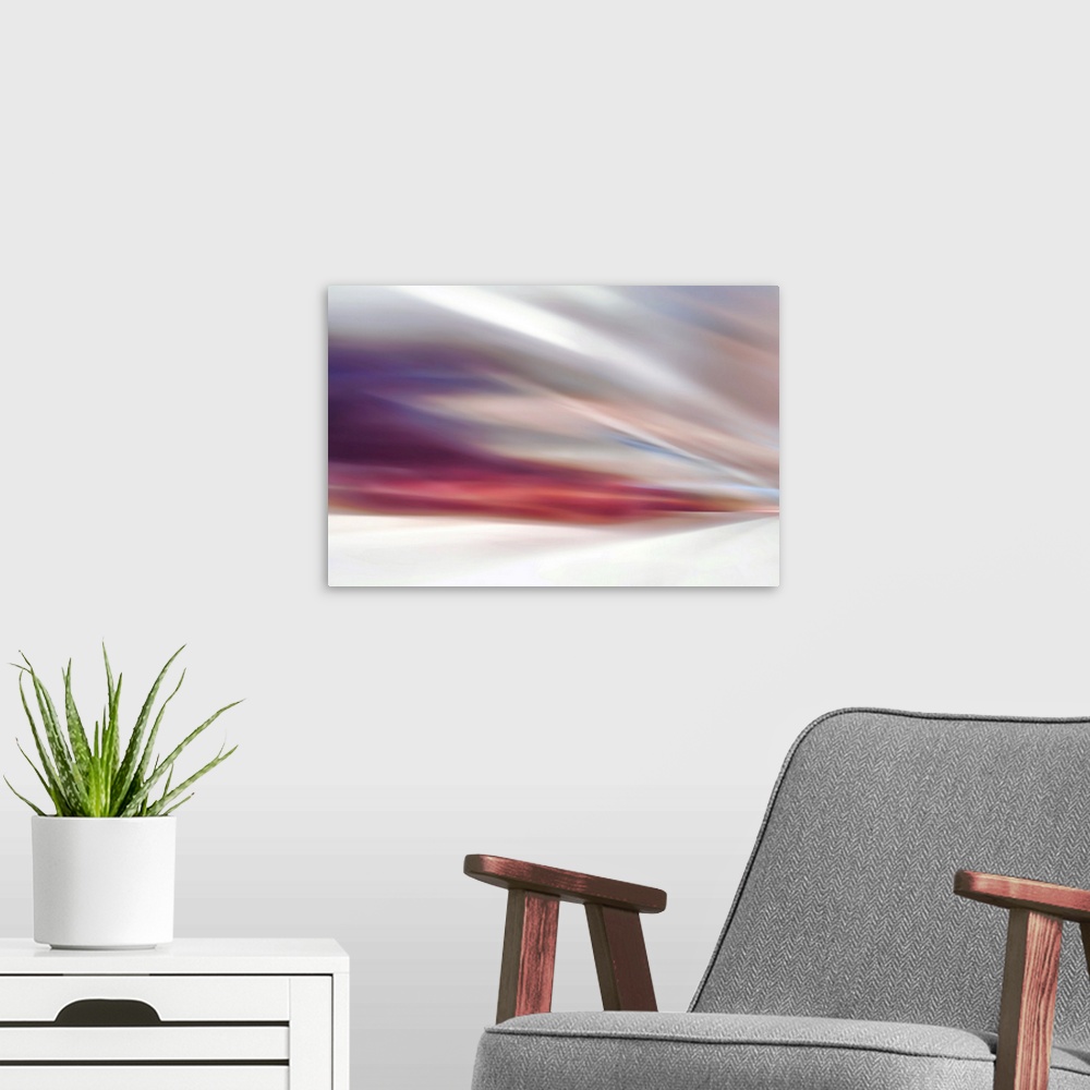 A modern room featuring Abstract view of a gentle sunset by a white sands beach.