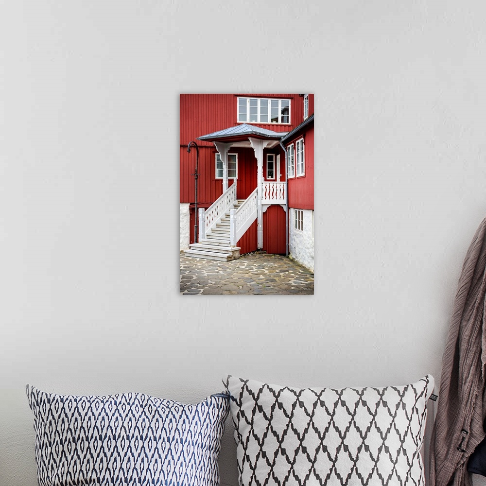 A bohemian room featuring Staircase leading up to the entrance of a red house.