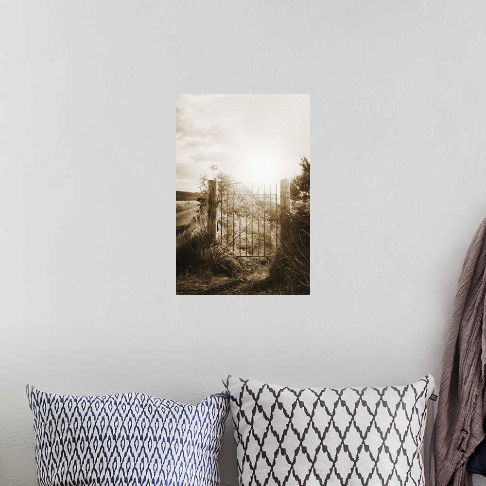 A bohemian room featuring A photograph of a gate fence gate silhouetted by a rising sun.