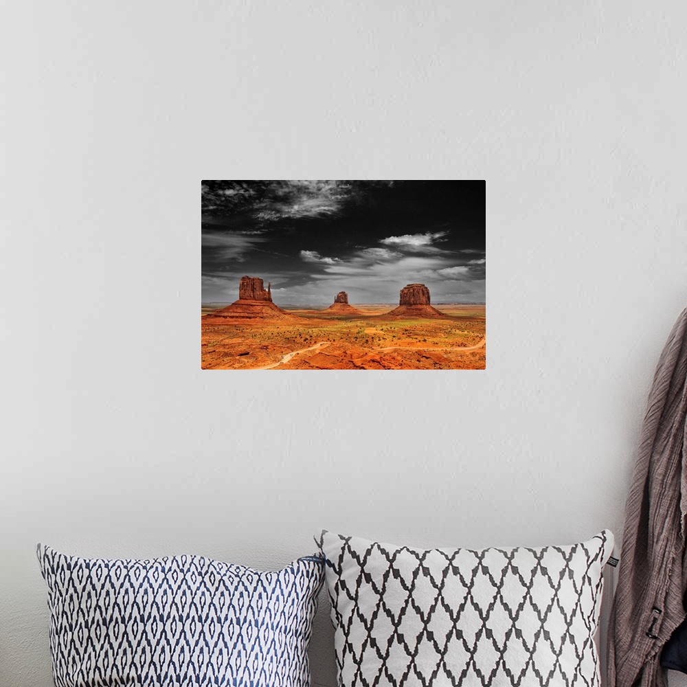 A bohemian room featuring Photograph taken of an immense desert with the sky in black and white and the terrain in color.