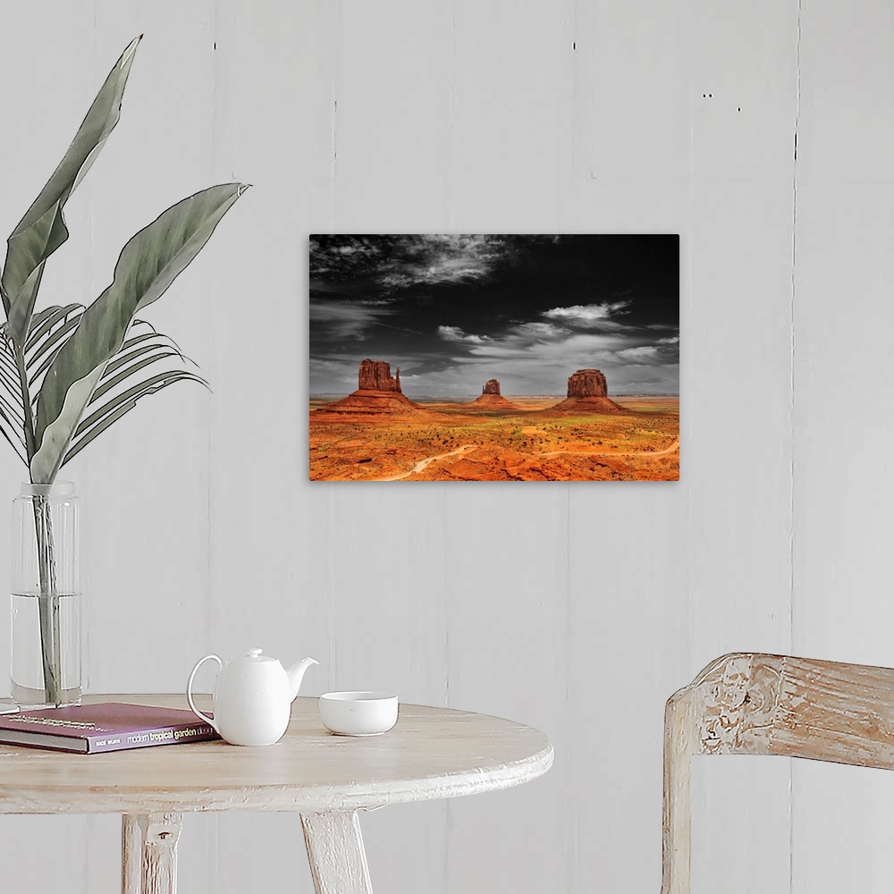 A farmhouse room featuring Photograph taken of an immense desert with the sky in black and white and the terrain in color.