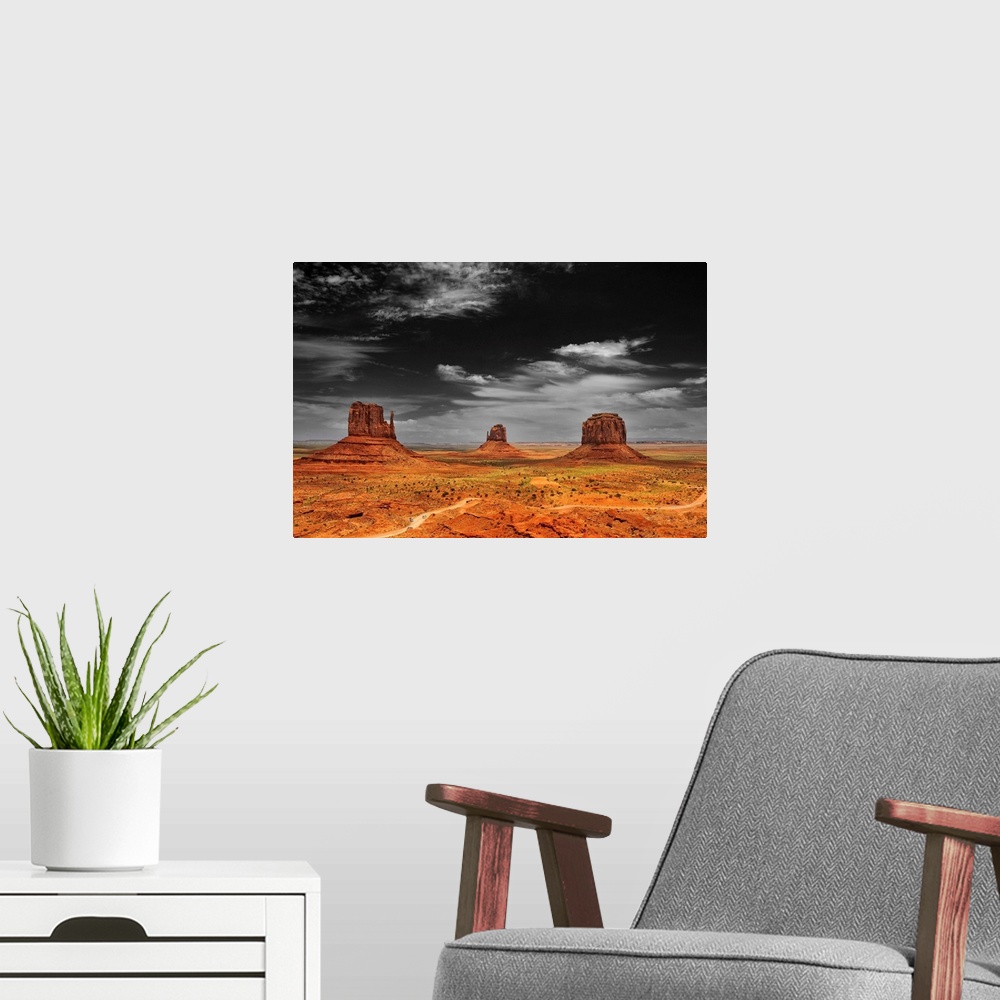 A modern room featuring Photograph taken of an immense desert with the sky in black and white and the terrain in color.