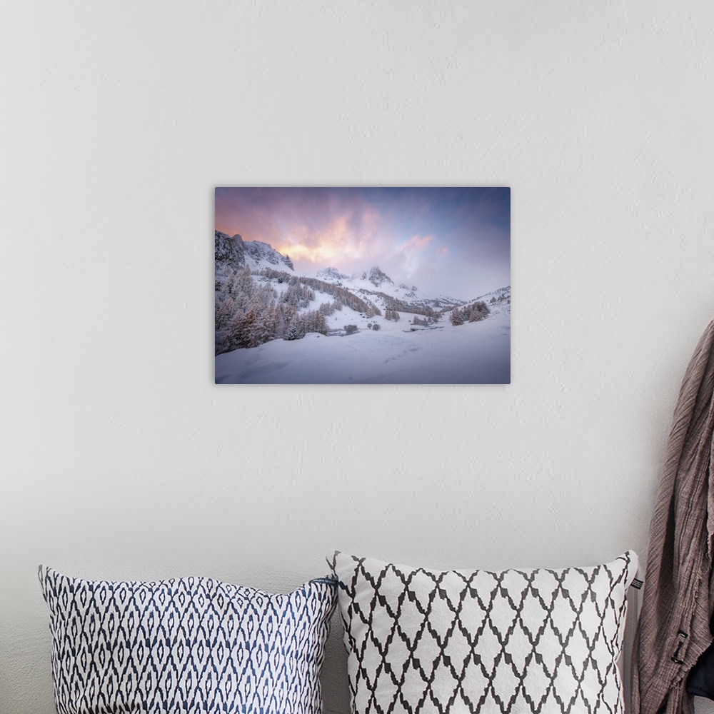 A bohemian room featuring Colored sunset landscape scene on a snowy mountain in the Alpes in France. A pine valley in winte...
