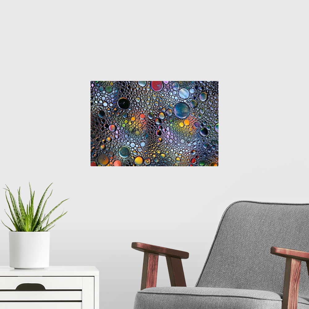 A modern room featuring Abstract photo of a multitude of bubbles in rainbow colors of different sizes.