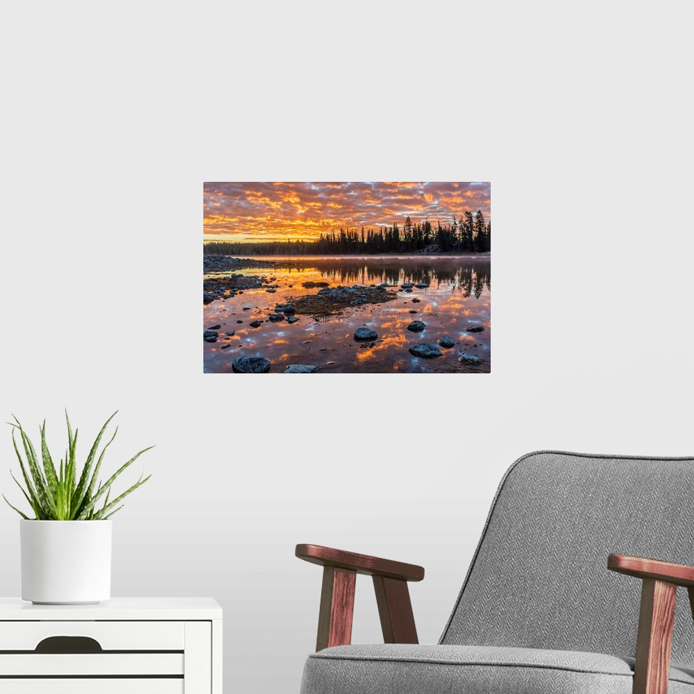 A modern room featuring Fine art photograph of a sunset illuminating the clouds over the Yellowstone River in Wyoming.