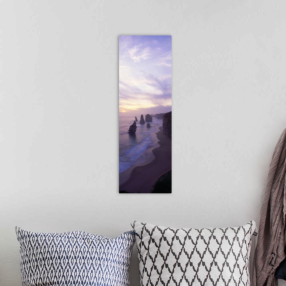 A bohemian room featuring Vertical panoramic photograph of shore with tall vertical rock formations in the ocean under clou...