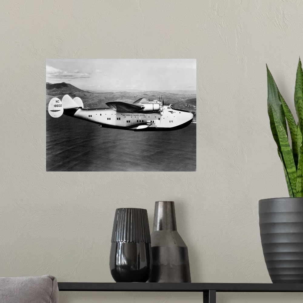 A modern room featuring 1930s 1940s Pan American Clipper Flying Boat Airplane In Flight.