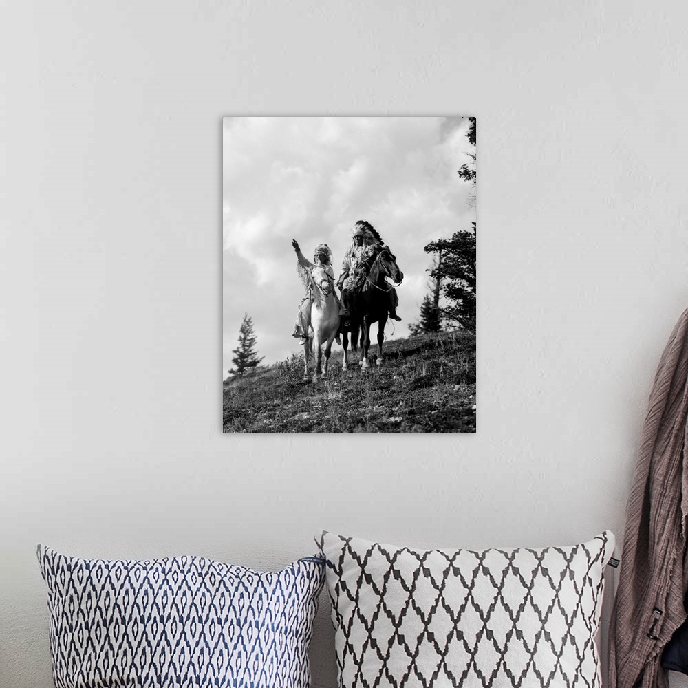 A bohemian room featuring 1930s Pair Of Sioux Indians In Headdresses On Horseback Pointing Out Trail.